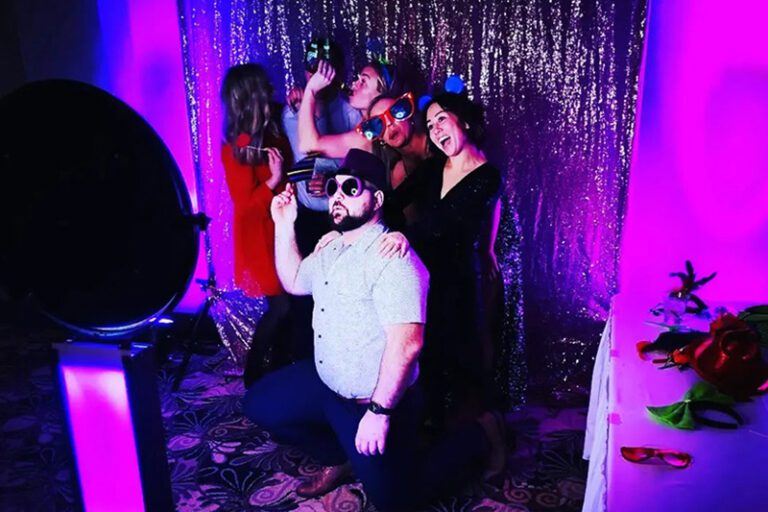 Guests posing for a party picture at a hoto booth rental in Kelowna